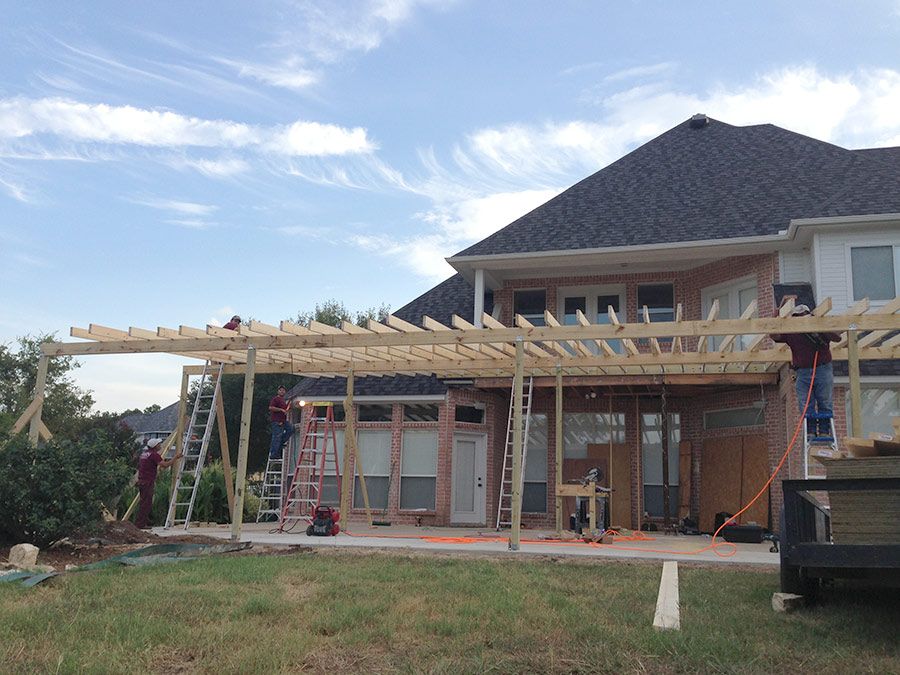 home second story expansion and ground level patio construction