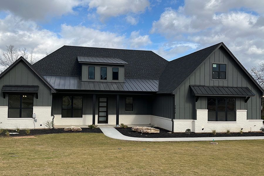 Shingle and metal roof installation by DRI Construction