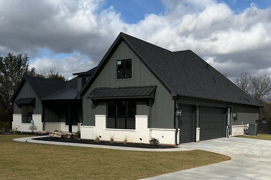 Shingle and metal roof installation by DRI Construction